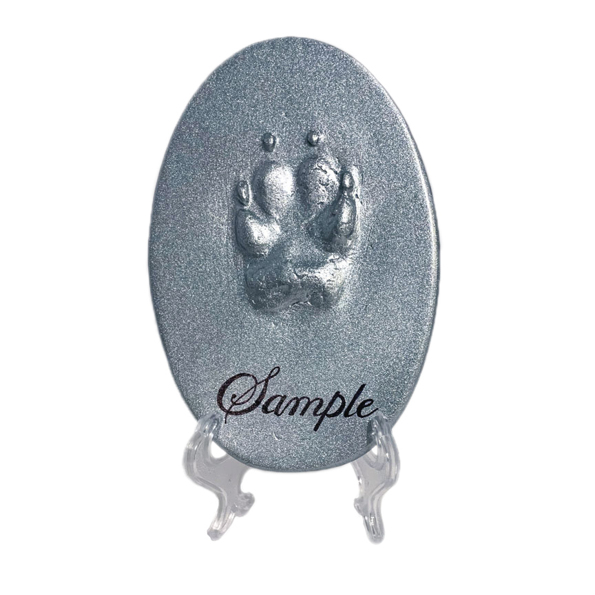 Clay Paw Print True Form Oval Silver shown on our optional display stand.